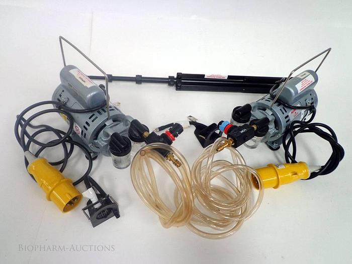 Two vacuum pumps in transport case