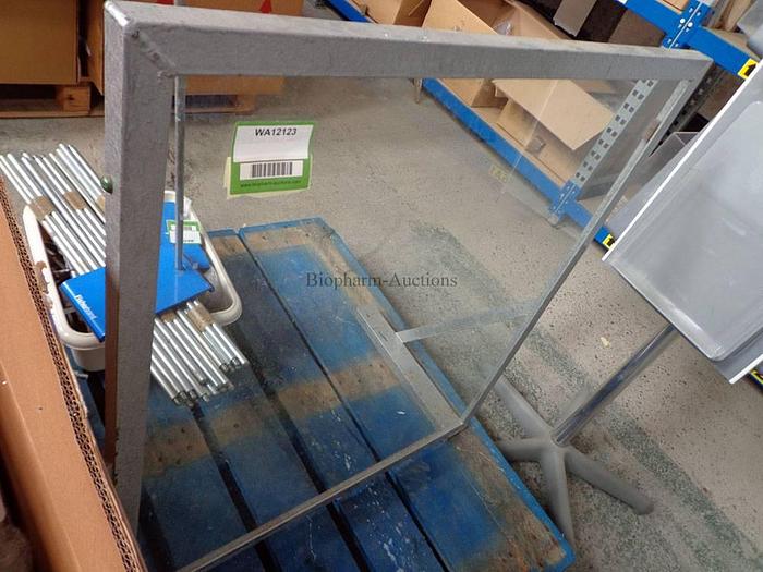 Metal framed glass panel splash protection shield (approx 800mm tall, 700mm wide)